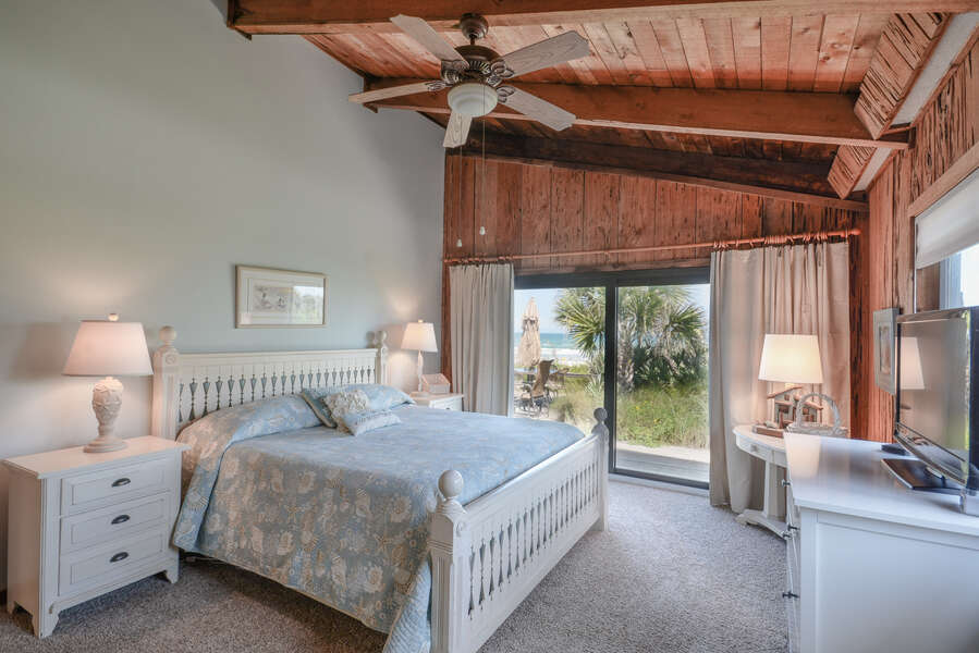 Wake up every morning with a view of the beach in the spacious master bedroom featuring sliders to the front deck, king size bed, flat screen TV and private master bath.