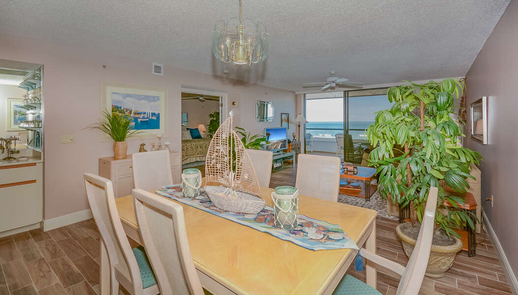 Ocean view dining room with seating for 6 with additional seating at the kitchen counter for 2.
