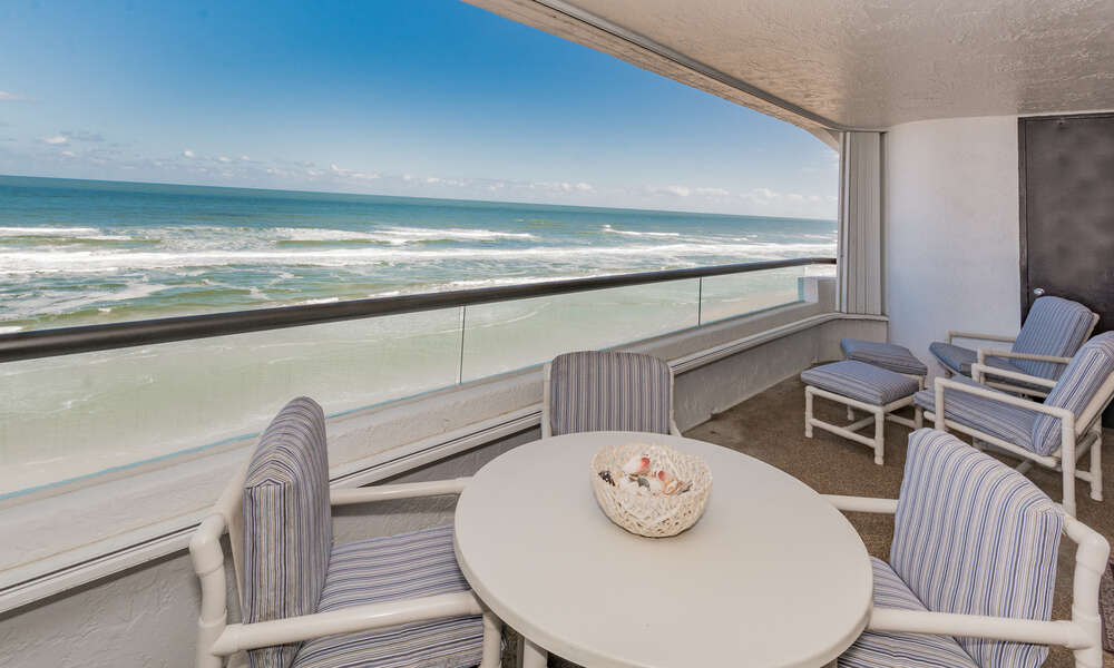 Oceanside private, oceanfront balcony of this New Smyrna Beach rental with balcony furniture.