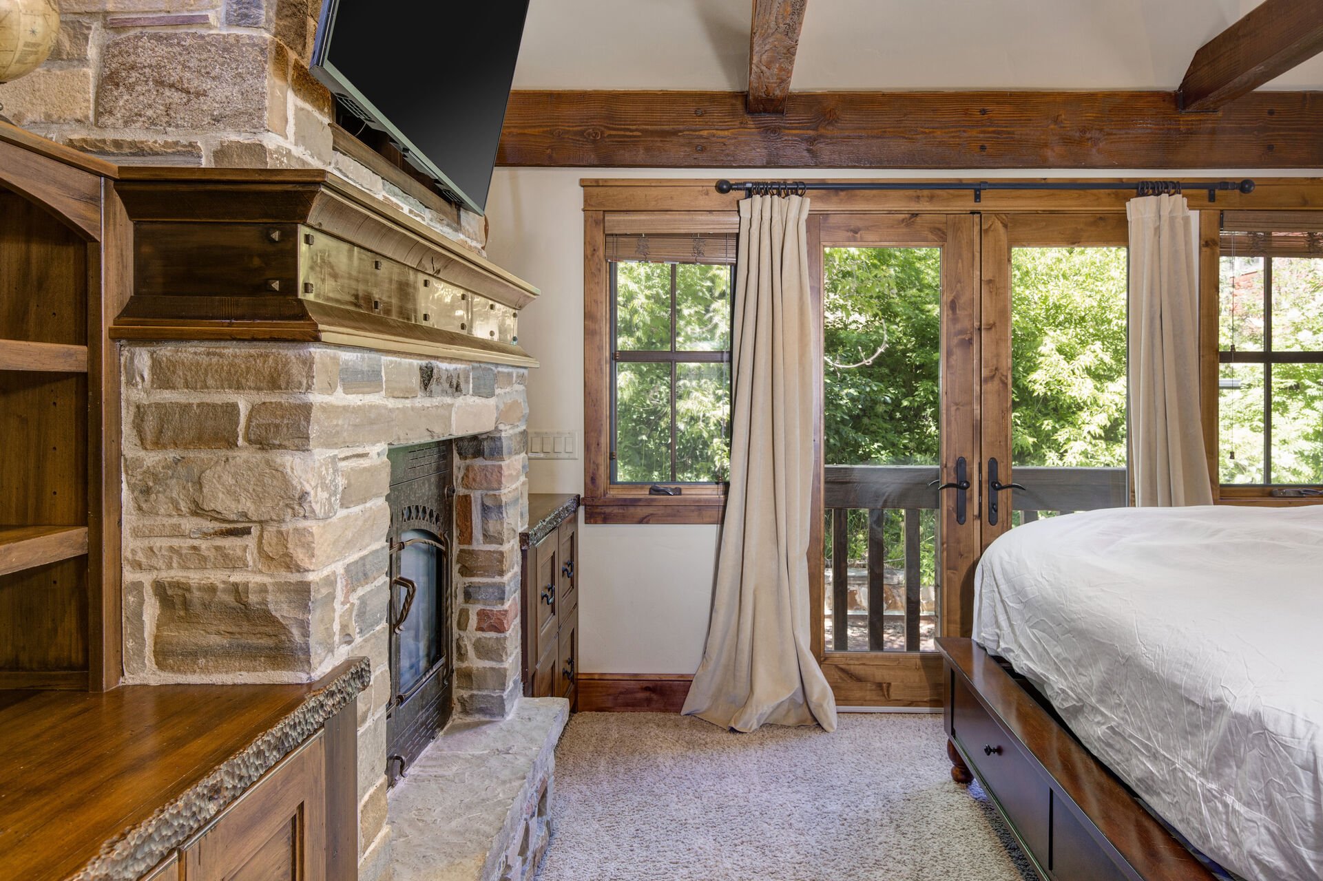 Master Bedroom 1 with King Bed, Gas Fireplace, HD TV/DVD, Deck Access and Private Bath