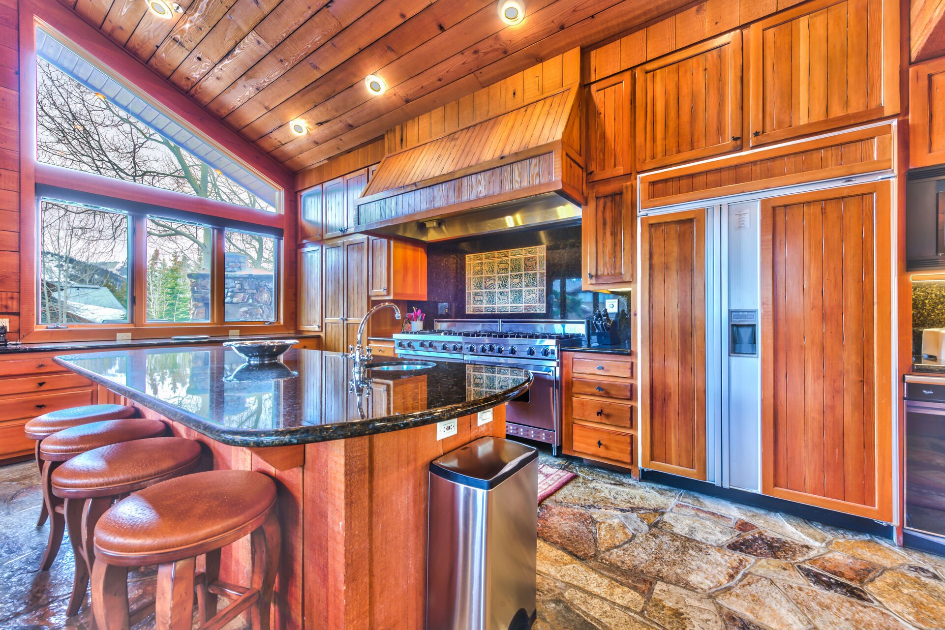 Fully Equipped Chef's Kitchen with Viking Appliances, Granite Countertops, and Bar Seating for 4