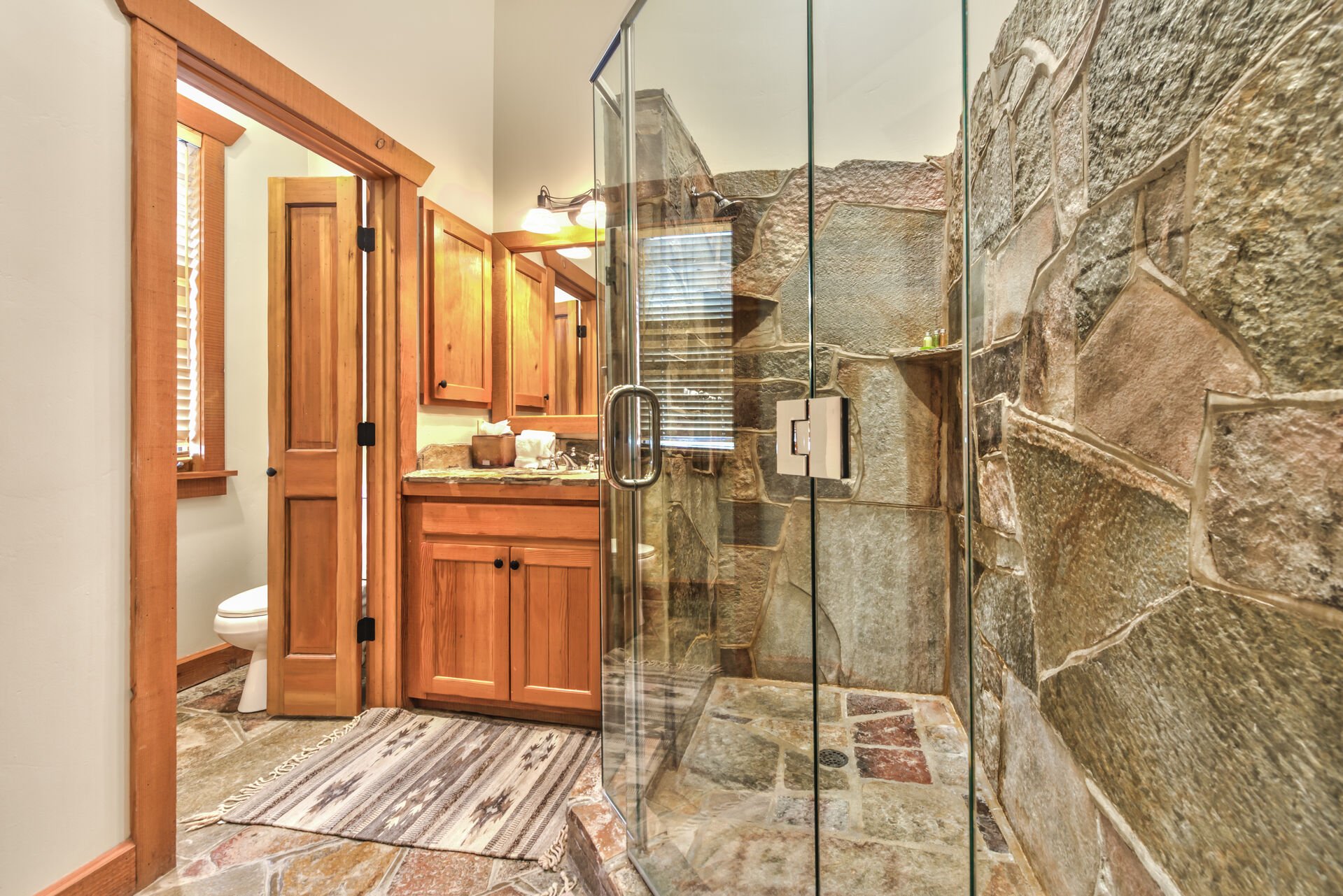 His or Her Master Bathroom with Stone Shower