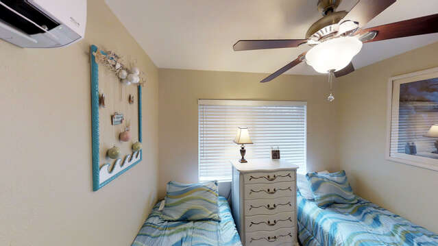 Third Bedroom Has Two Twin Beds and Large Dresser.