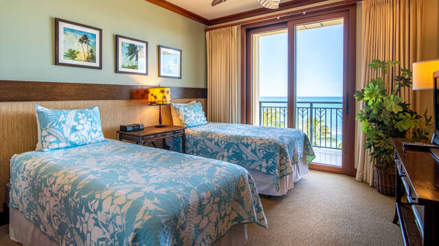 Our Ko Olina Beach Villa's Second Bedroom with Lanai Access, Ceiling Fan & TV