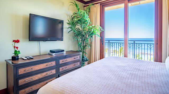 Master Bedroom with Flat Screen TV, King Sized Bed, and Lanai Access