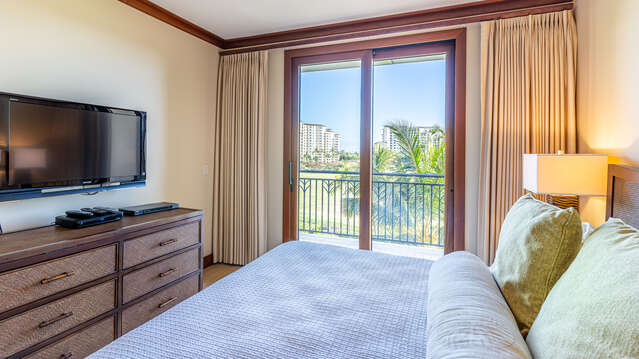 Bedroom with access to Lanai and Television