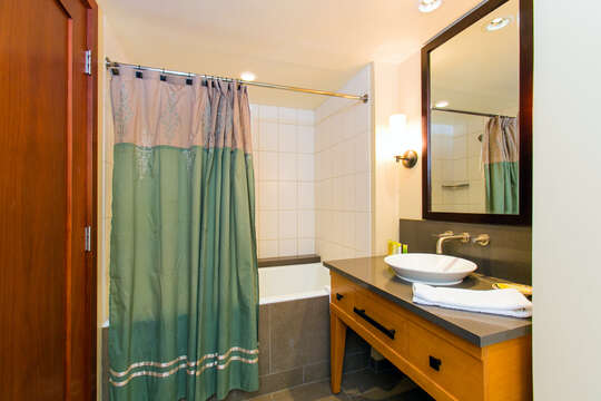 Bath with Tub / Shower Combination, and Single Sink Bathroom Vanity.