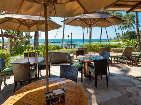 Outdoor Dining Tables, Table Umbrellas at the Beachfront Bar with Ocean View.