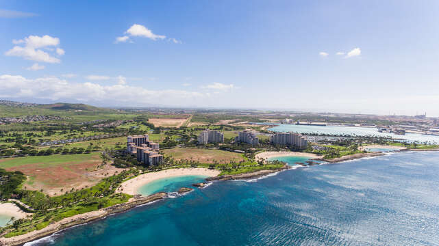 Aerial view of Ko Olina, the Pacific Ocean, and the bright blue lagoon beaches.