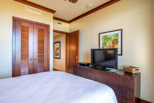 Queen Bedroom with Closet, Ceiling Fan, and Flat Screen TV in Our Ko Olina Beach Rental