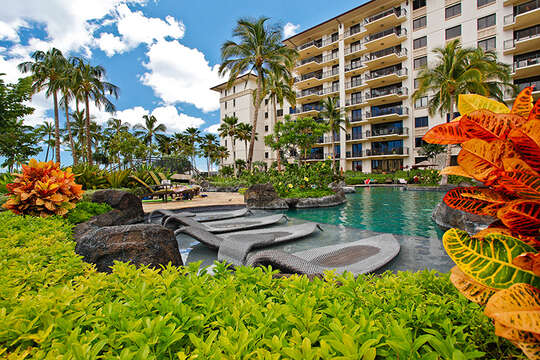 Water Loungers in a Tropical Setting with View of Beach Villas at Ko Olina