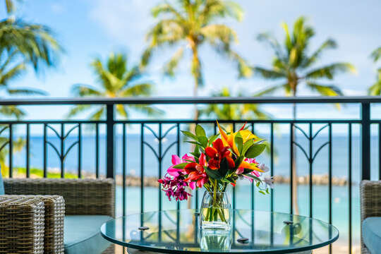 tropical flowers in the villas lanai overlooking the ocean and beach