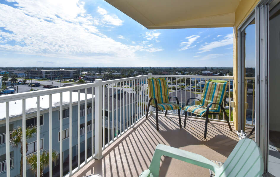 The balcony of this private condo in New Smyrna Beach, complete with furniture.