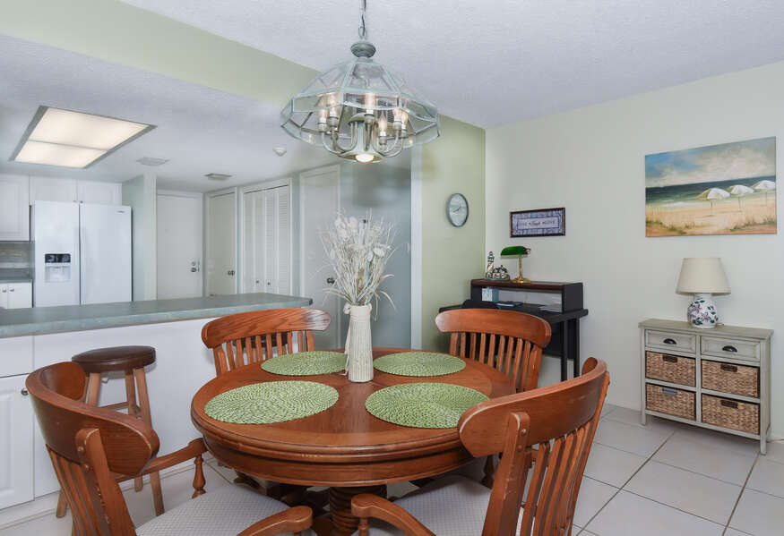 The dining area of this private condo in New Smyrna Beach with seating for 4.