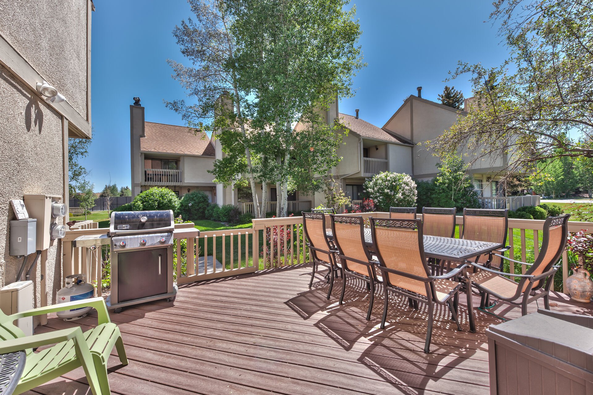 Front Deck with BBQ, and Outdoor Dining Area with Seating for 8.