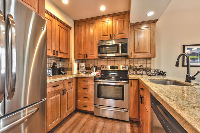 Fully Equipped Kitchen with Custom Cabinets, Granite Counters, Stainless Steel Appliances