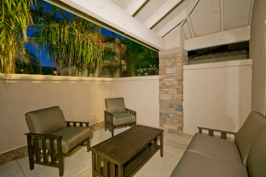 Covered patio has private gate that leads to pool area.