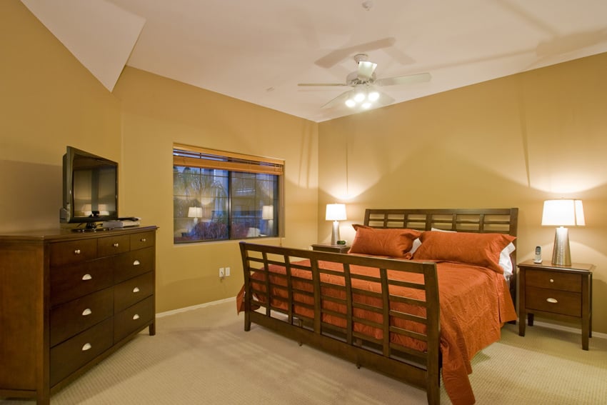 Upstairs master bedroom with a king bed and flat screen TV