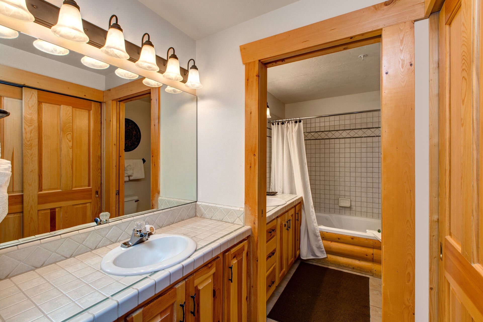 Master Bath with Separate Vanities and a Jetted Tub/Shower Combo