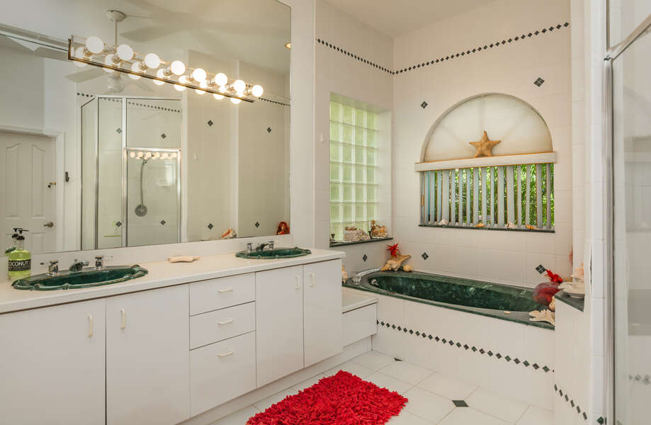 Master bath with his/her sinks, Jacuzzi tub and walk-in shower.