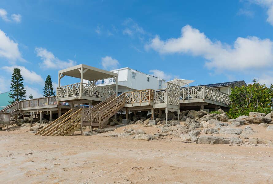 View of this New Smyrna beach cottage rental and deck from the ocean.