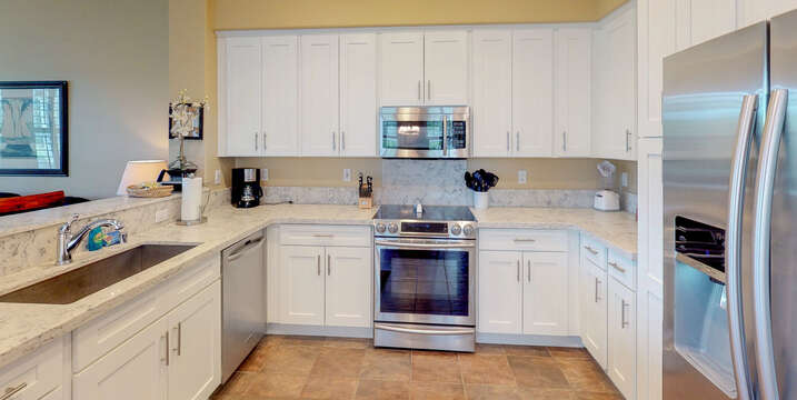 Enjoy White Cabinets and Plenty of Counter Space in Kitchen.