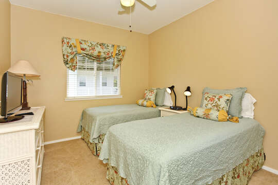 Third Bedroom with Two Twin Beds and White Dresser.