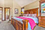 Main level Grand Master Bedroom with king bed and private bathroom