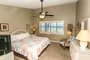 The most spacious bedroom in the house specifically for the primary occupants to relax and unwind.