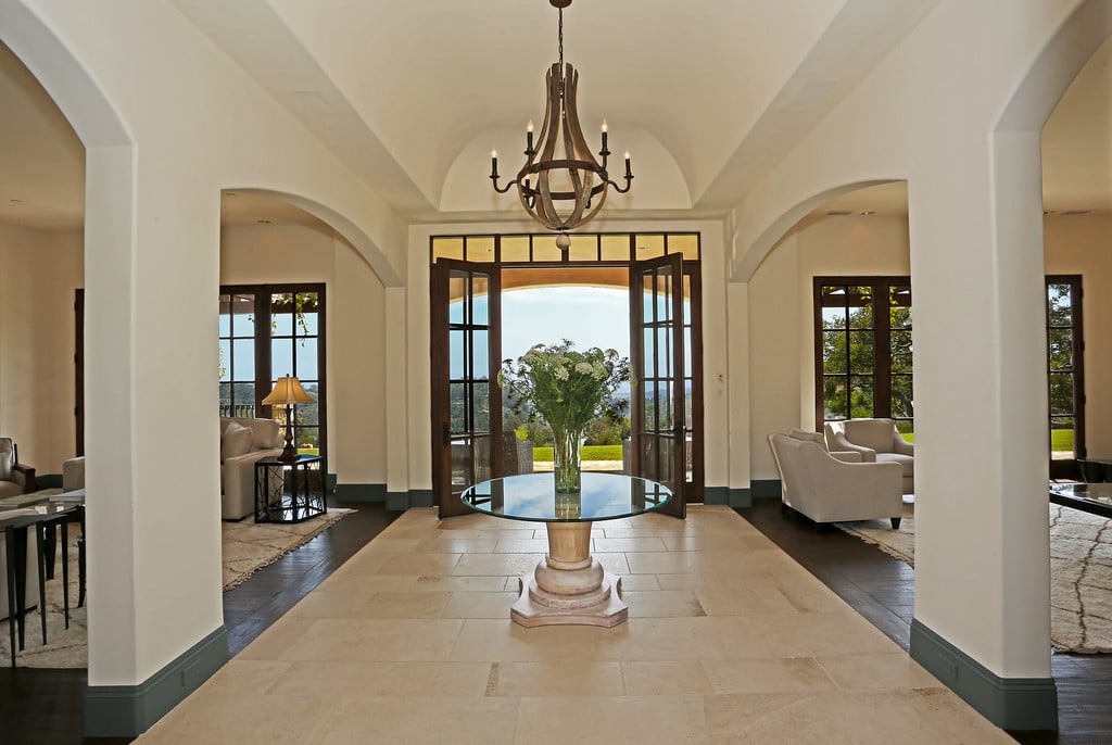 Entry between two elegant Living Rooms