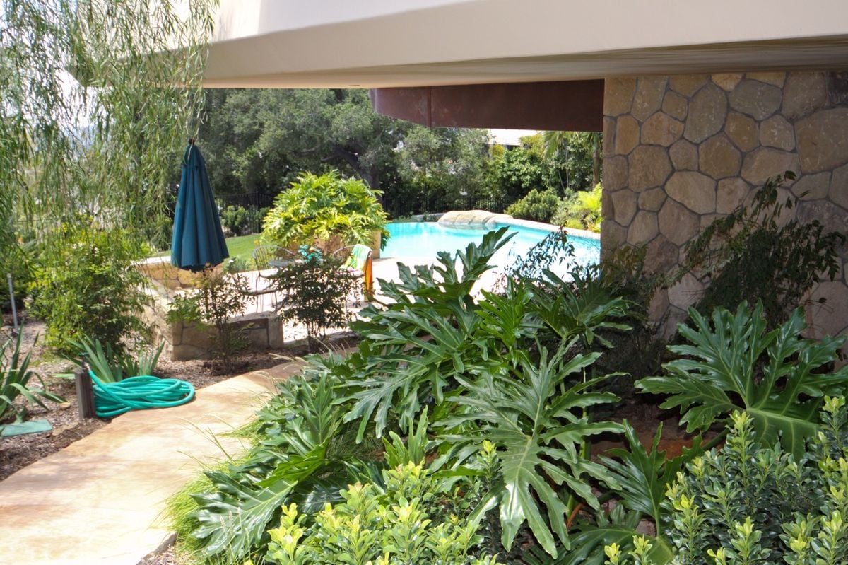 Lush landscaping surrounds the property