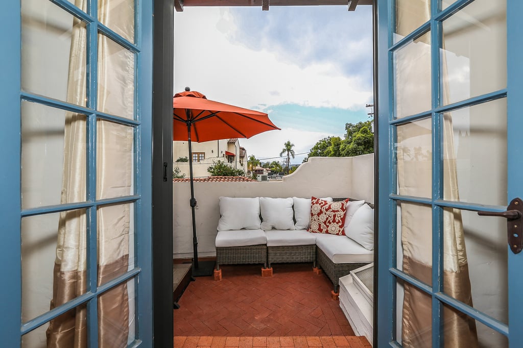 French doors lead to spa deck and city views