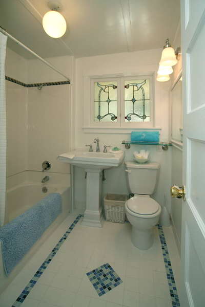 Bathroom featuring antique stained glass window
