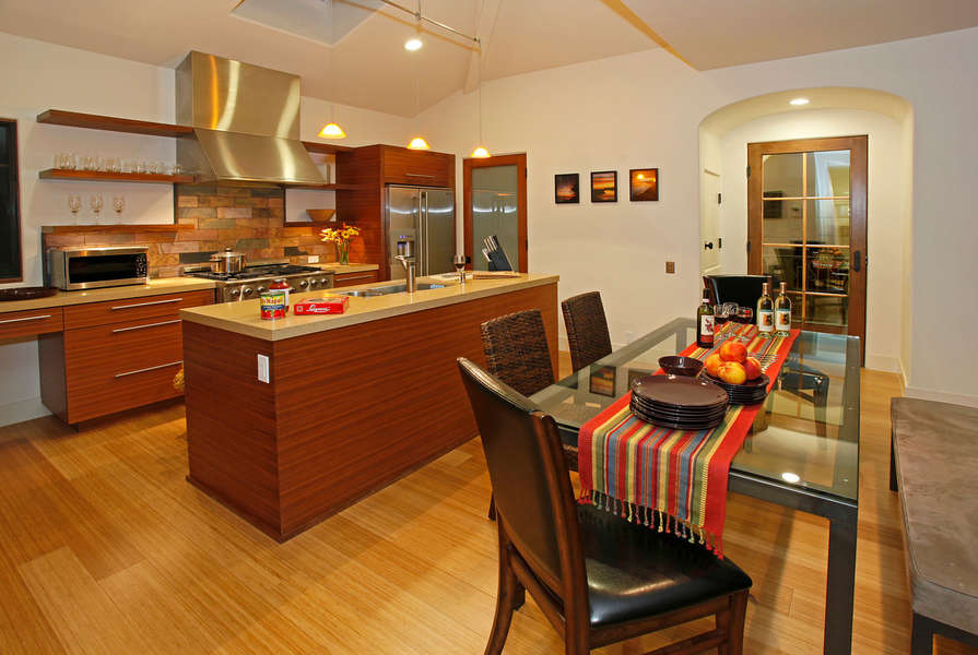 Close to kitchen and dining is a balcony w/barbeque