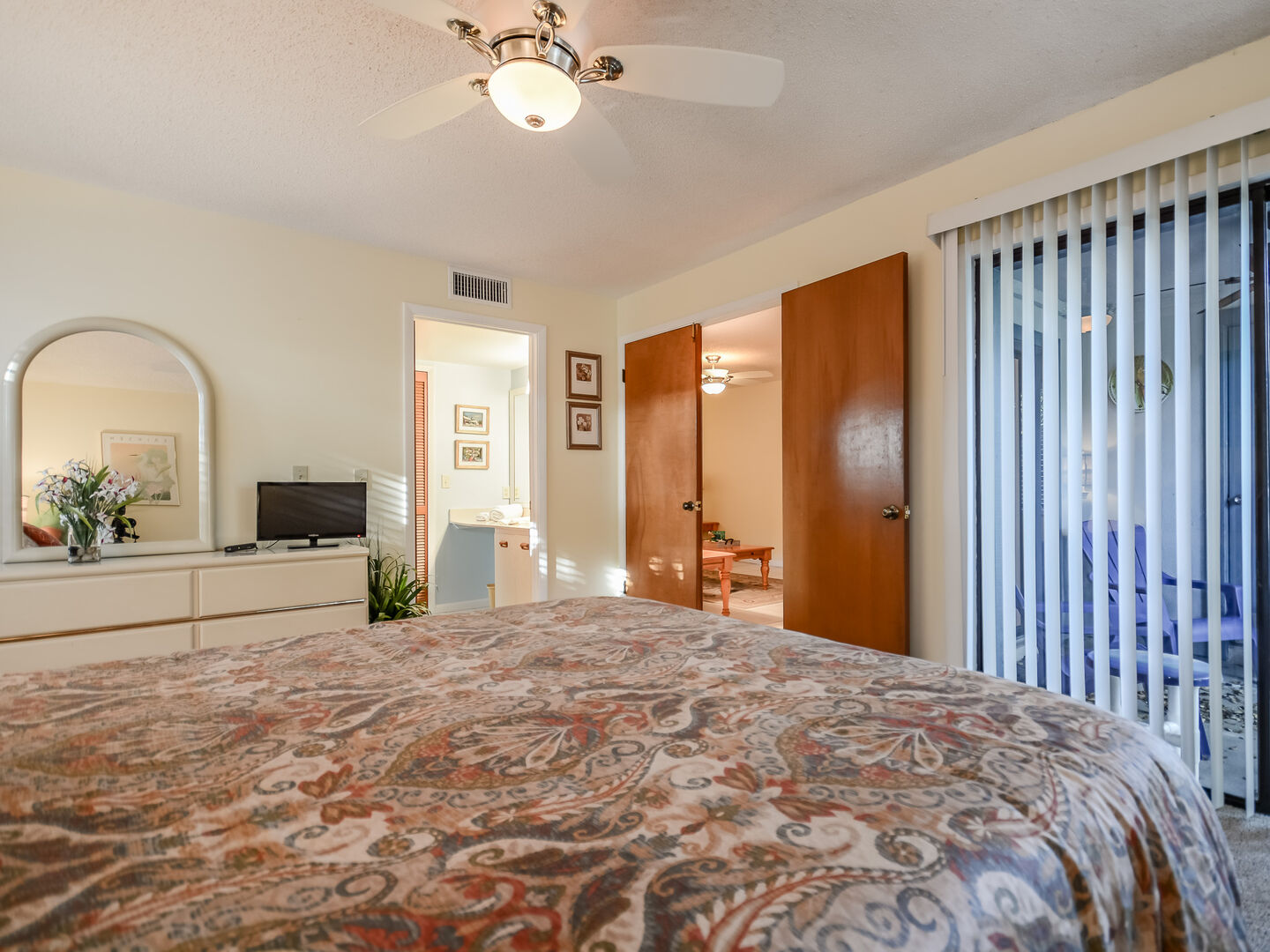 The master bedroom also features a flat screen HDTV, private bath and sliders to the patio.