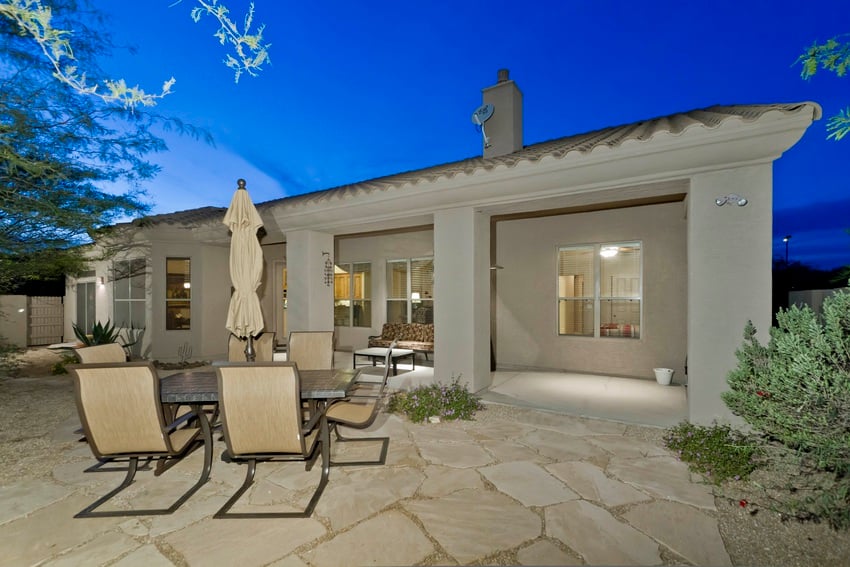 Enjoy the backyard with either dining or lounging off the covered patio