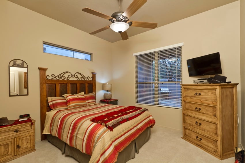 Get in the true southwestern spirit in this bedroom with a view of the back patio