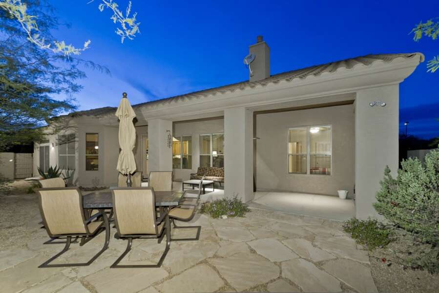 Enjoy the backyard with either dining or lounging off the covered patio