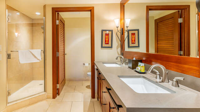 Master Bathroom with shower, toilet, and dual sinks.