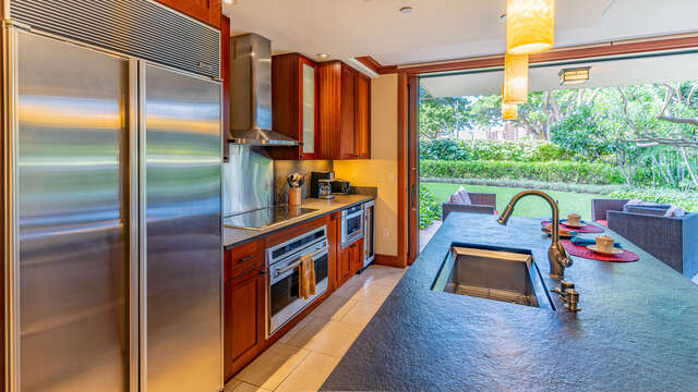 Kitchen with View of lanai, modern amenities, and plenty of seating.