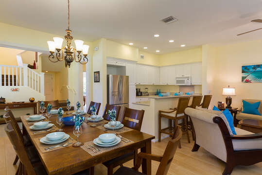 Dining Table, Chairs, Kitchen with Bar, High Chairs, and Armchair.