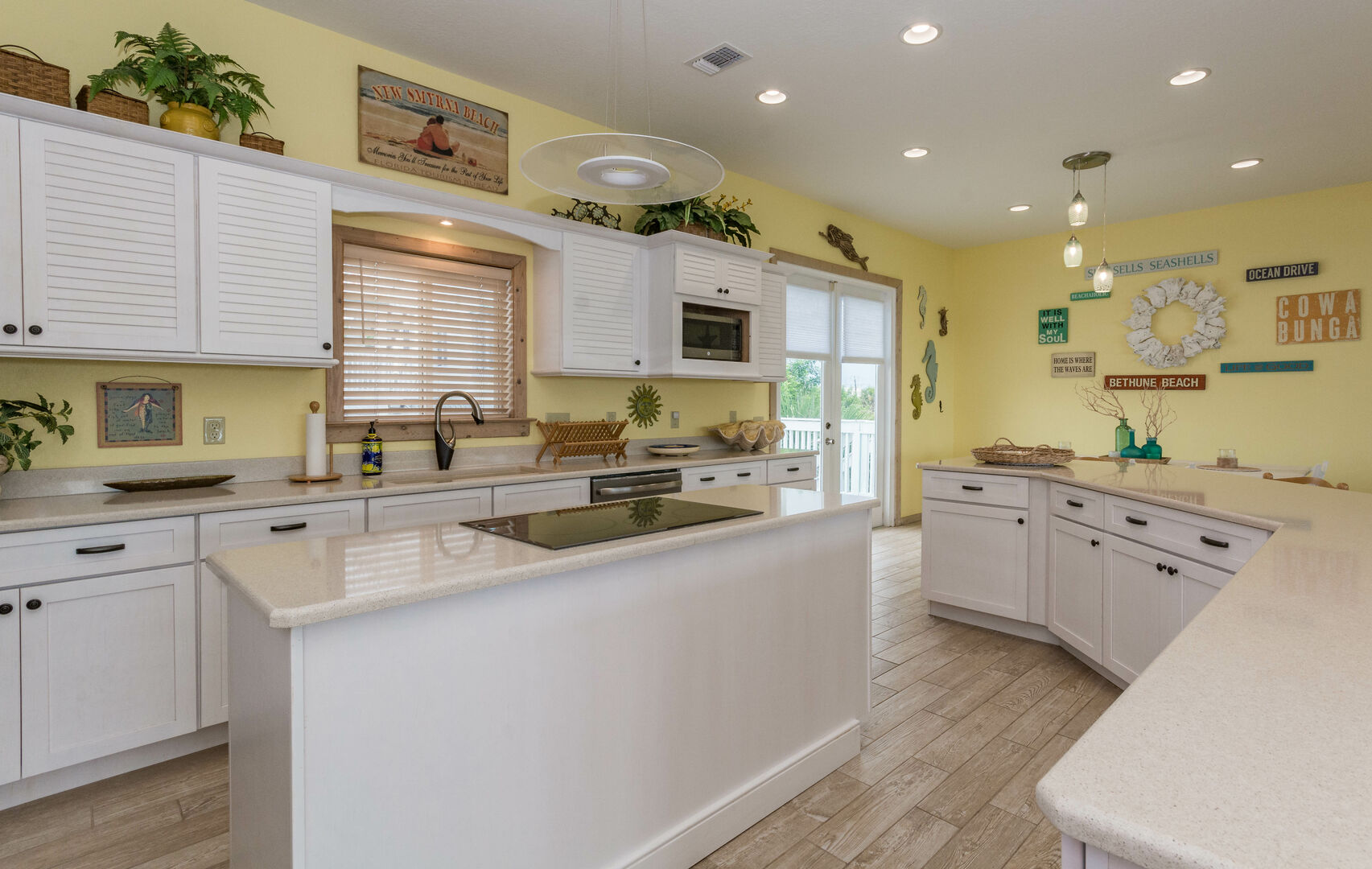 Fully equipped kitchen with additional seating at the kitchen counter.