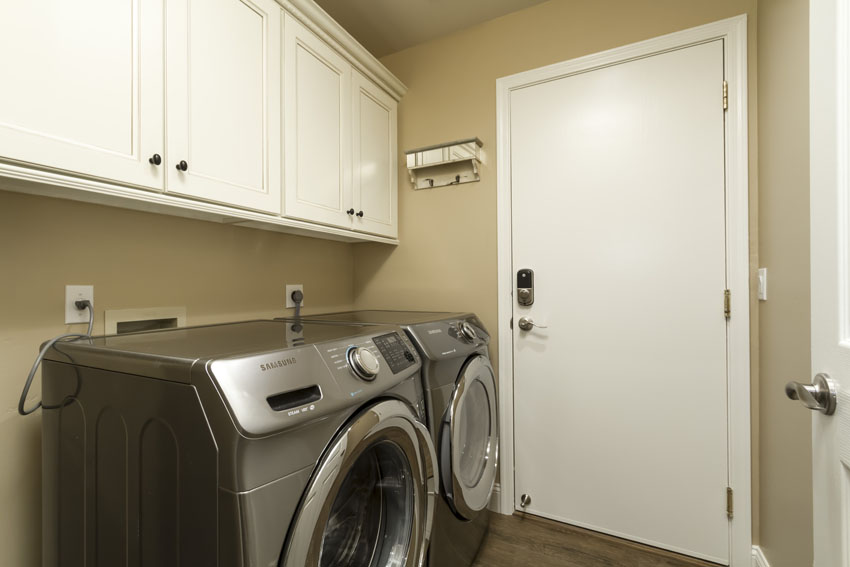 New front loading washer and dryer in the laundry room.
