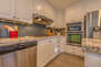 Upper level fully equipped kitchen with stainless steel appliances