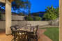 East patio with table for six people. Enjoy the morning sun, mountain views, green grass and citrus trees.
