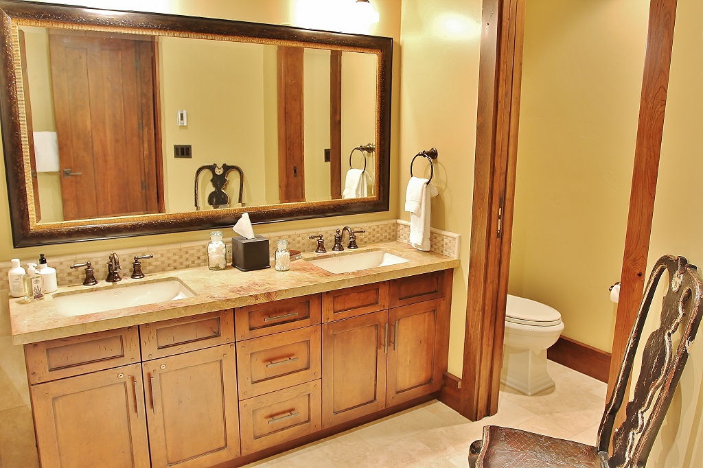 Grand Master bathroom with stone shower, tub, and dual vanities