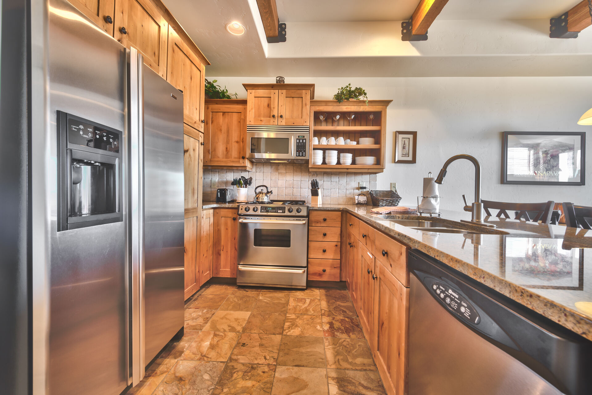 Fully Equipped Kitchen with Granite Counters and Stainless Steel Appliances