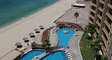View of pool area from balcony - shows main pool, swim up bar pool and wading pool