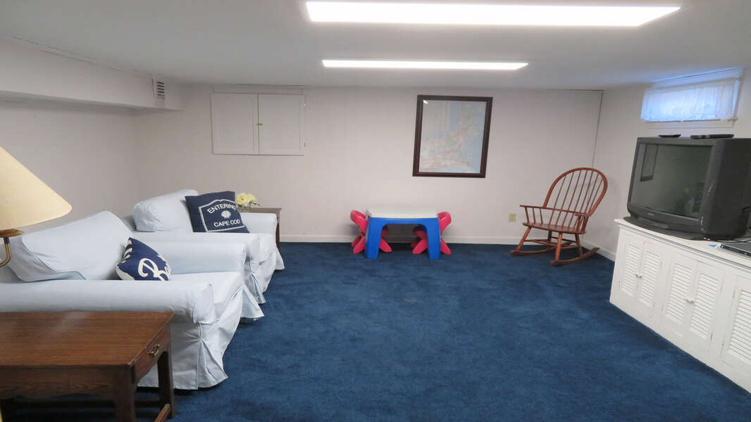 Bonus area on the lower level -Great place for the kids to watch a show or their favorite video! 26 Ridgevale Road South Harwich Cape Cod New England Vacation Rentals #BookNEVRDirectPlaceOnTheCape