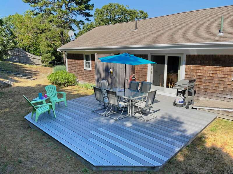 Awesome view of the deck, outdoor shower, outdoor dining area, and gas grill - 26 Ridgevale Road South Harwich Cape Cod New England Vacation Rentals #BookNEVRDirectPlaceOnTheCape
